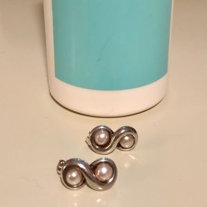 Infinity pearl earrings by Tiffany and Co.
